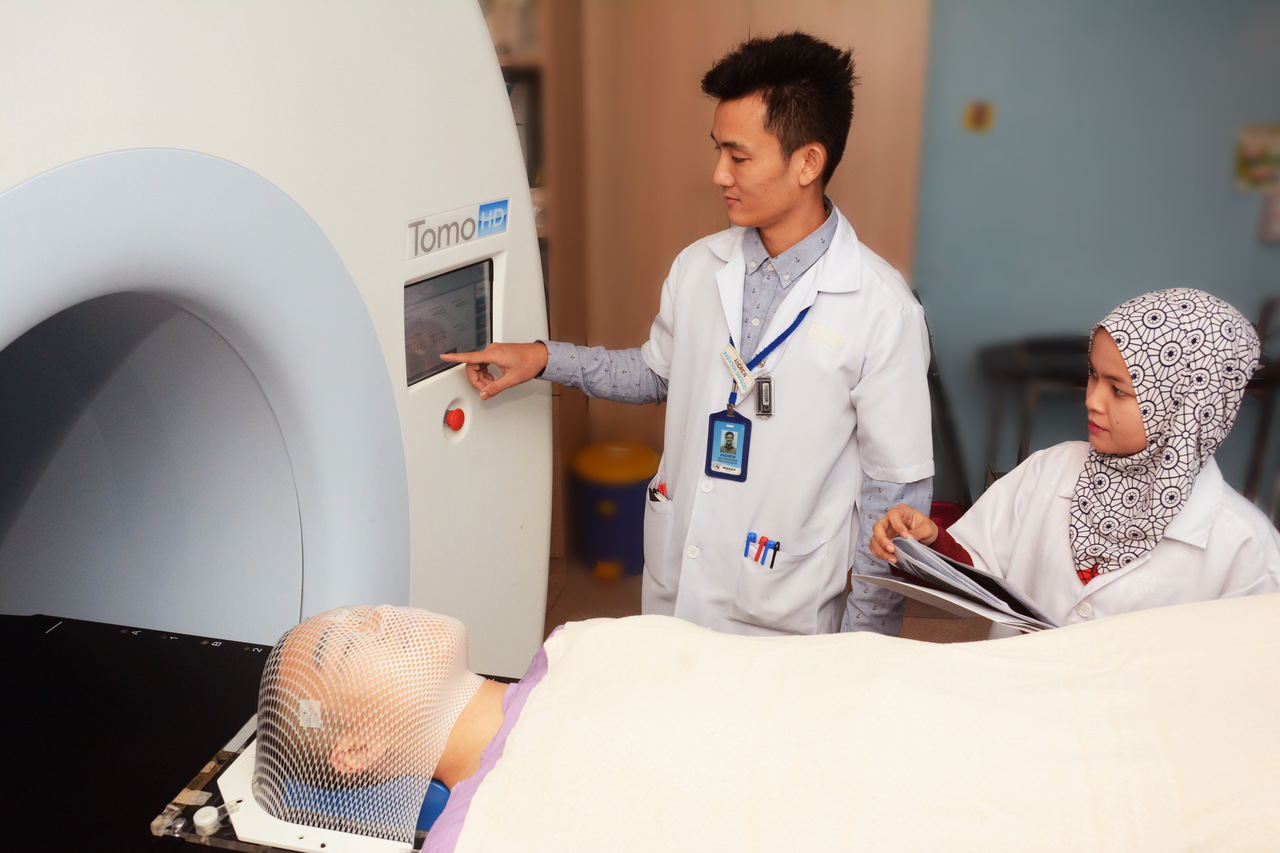 Tomotherapy-image guided, intensity-modulated radiation therapy (IMRT)