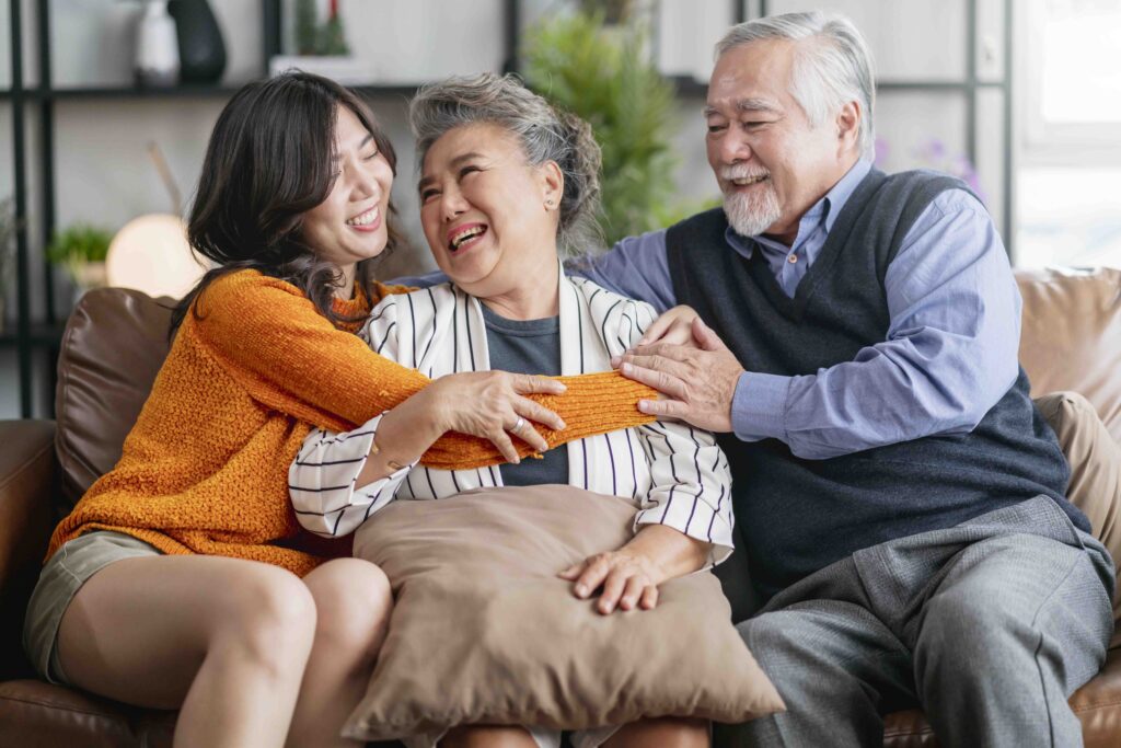 happiness asian family candid of daughter hug grandparent mother